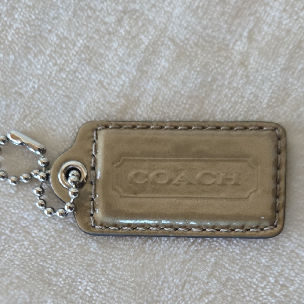 Coach Gold Leather Hang Tag.
